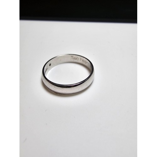 347 - A hallmarked 9ct white gold ring inset with a small genuine diamond inscribed inside 2 hearts- 1 sou... 