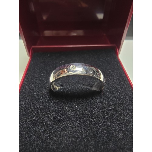 347 - A hallmarked 9ct white gold ring inset with a small genuine diamond inscribed inside 2 hearts- 1 sou... 