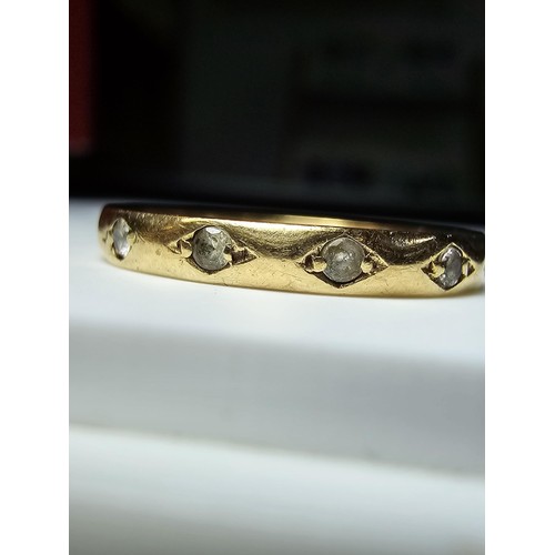 352 - A 9ct yellow gold ring inset with faceted rock crystal stones all the way around, in excellent clean... 