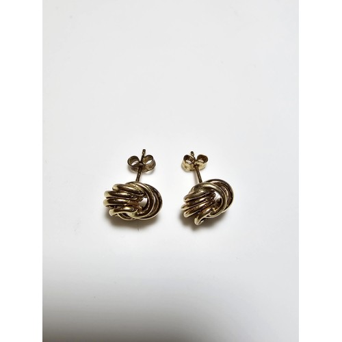 356 - A pair of 9ct yellow gold knot formed stud earrings complete with butterfly backs, in excellent clea... 