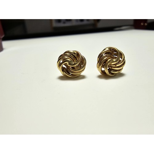 356 - A pair of 9ct yellow gold knot formed stud earrings complete with butterfly backs, in excellent clea... 