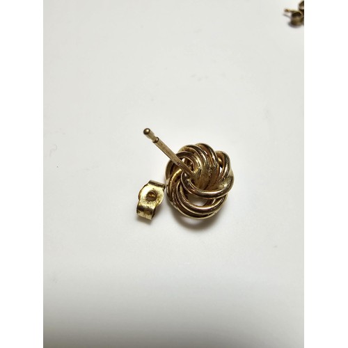 356 - A pair of 9ct yellow gold knot formed stud earrings complete with butterfly backs, in excellent clea... 