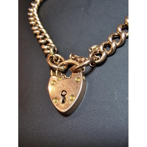 358 - A stunning 9ct rose gold curb link bracelet with a chunky 9ct rose gold padlock, in excellent clean ... 