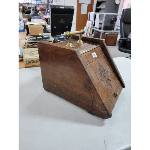 391 - Antique oak coal box with metal lining in good overall condition with carved flower to the front and... 