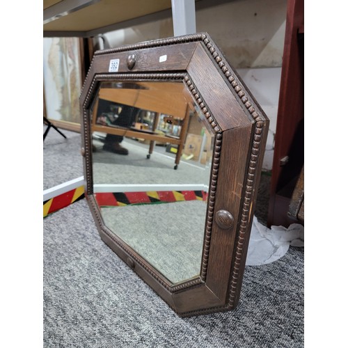 392 - Good quality art deco wooden framed octagonal bevel edged mirror in overall good condition with hang... 