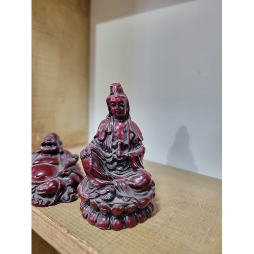 395 - Quantity of resin figurines to inc a small red Buddha, a kneeling Chinese army figure, an Aztec Maya... 