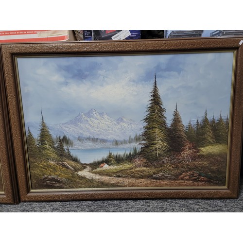 399 - 2x wooden carved framed oil on canvas alpine scenes both are signed to the lower right, the frames h... 