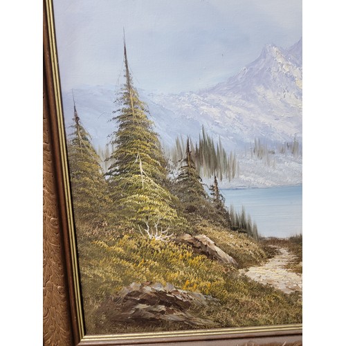 399 - 2x wooden carved framed oil on canvas alpine scenes both are signed to the lower right, the frames h... 