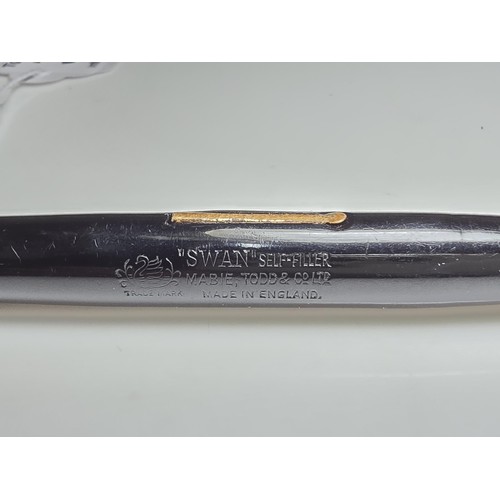 329 - A vintage Swan Mabie Todd fountain pen with a Swan 14ct gold nib, in good usable condition and ready... 