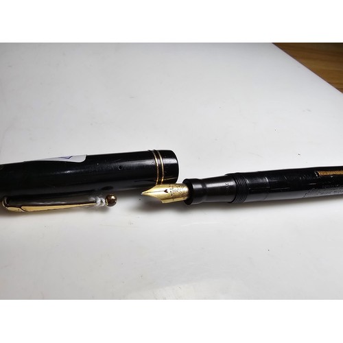 329 - A vintage Swan Mabie Todd fountain pen with a Swan 14ct gold nib, in good usable condition and ready... 