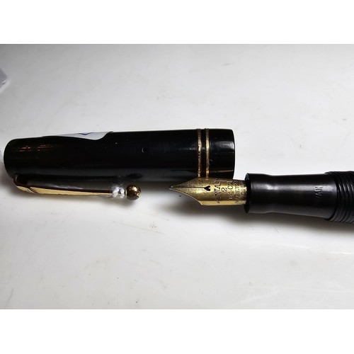 329 - A vintage Swan Mabie Todd fountain pen with a Swan 14ct gold nib, in good usable condition and ready... 