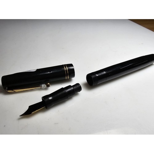 329 - A vintage Swan Mabie Todd fountain pen with a Swan 14ct gold nib, in good usable condition and ready... 