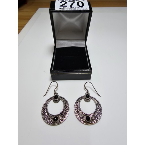 270 - A pair of good quality sterling silver hoop drop earrings with an ornate worked metal design inset w... 