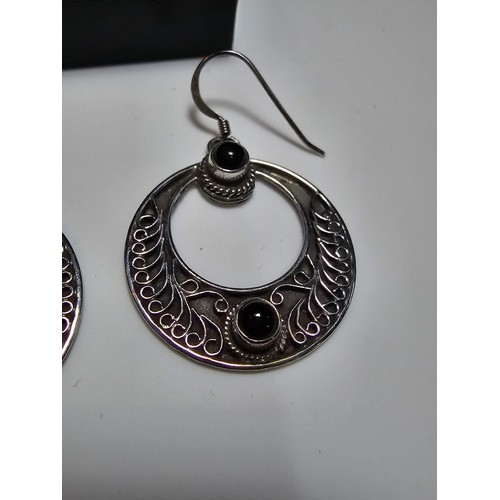 270 - A pair of good quality sterling silver hoop drop earrings with an ornate worked metal design inset w... 