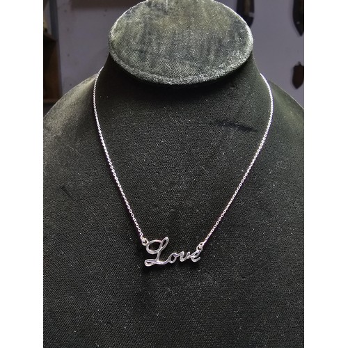 282 - A 925 silver necklace pendant with the phrase 