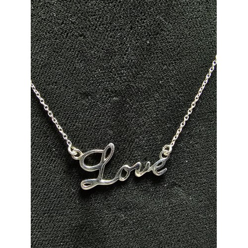 282 - A 925 silver necklace pendant with the phrase 