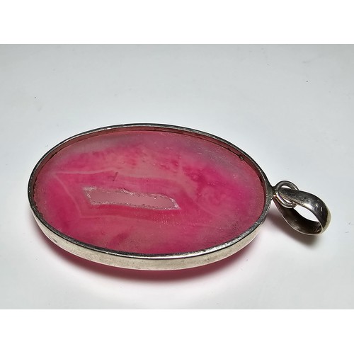 283 - A large 925 silver pendant inset with a large natural dyed pink crystal along with a Stanley London ... 