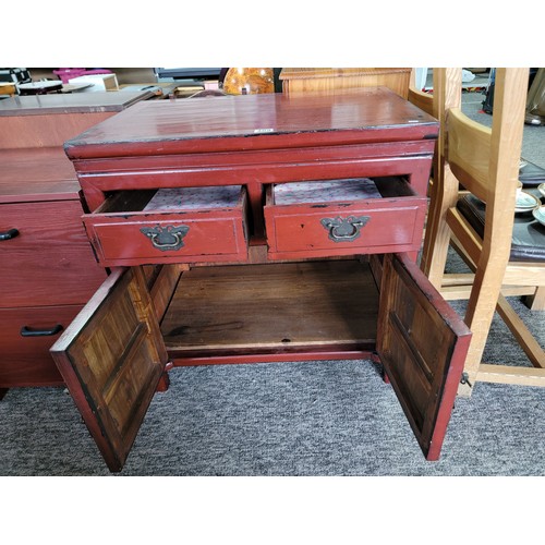 410 - Two drawer over two door mahogany painted wooden cupboard with locking pin to the bottom drawers mea... 