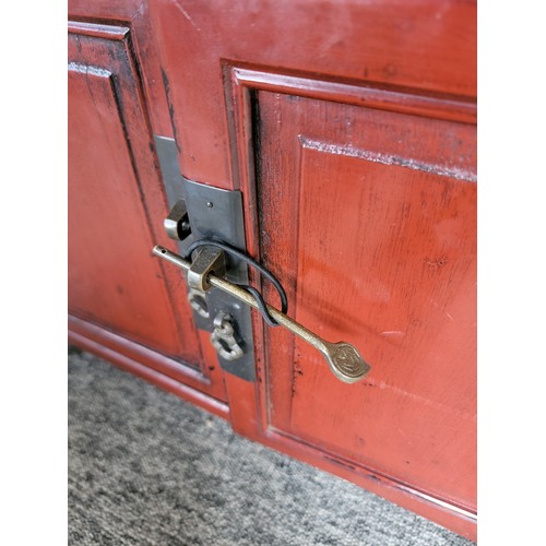 410 - Two drawer over two door mahogany painted wooden cupboard with locking pin to the bottom drawers mea... 