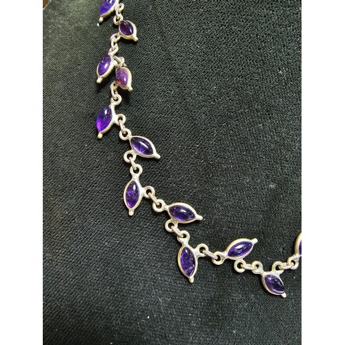 284 - A pretty 925 silver necklace inset with amethyst gemstones all the way around, in excellent clean co... 