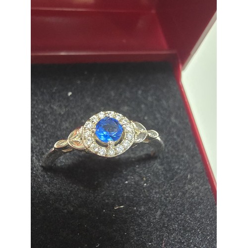 291 - A new and unused 925 silver dress ring inset with a sparkly blue crystal CZ stone and clear CZ stone... 