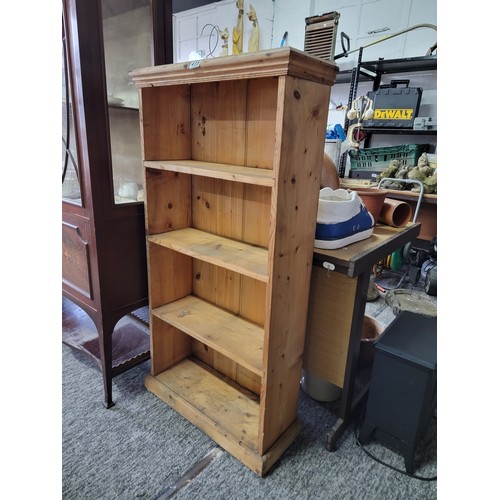 415 - Good quality solid pine 4 shelf book case showing signs of use, stands at 125cm high, 63cm wide and ... 