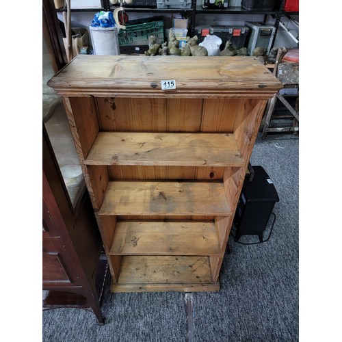 415 - Good quality solid pine 4 shelf book case showing signs of use, stands at 125cm high, 63cm wide and ... 