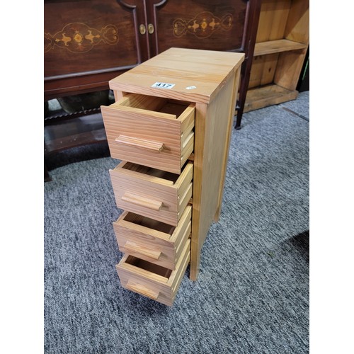 417 - Modern pine 4 drawer narrow storage cabinet in good overall condition measures 60cm high 20cm wide a... 