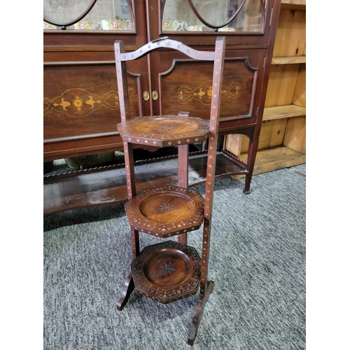 421 - Good quality Indian 3 tier hard wood cake stand with copper and brass inlay on the trays and around ... 