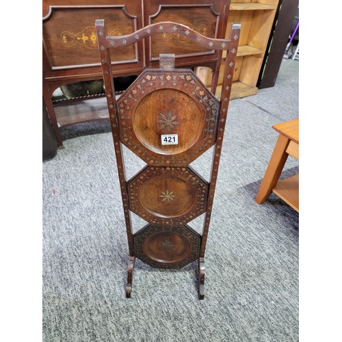 421 - Good quality Indian 3 tier hard wood cake stand with copper and brass inlay on the trays and around ... 