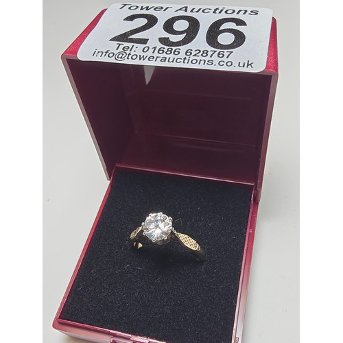 296 - A good quality gold and silver solitaire dress ring featuring a large sparkly crystal CZ stone, full... 