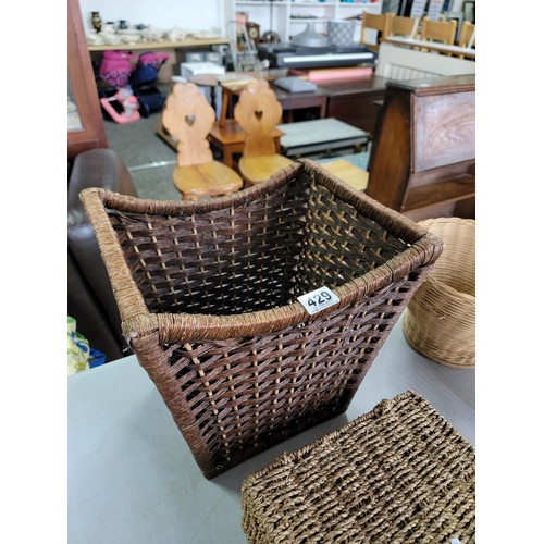 429 - Quantity of household items inc a wicker bin, a lidded rattan storage box, a quantity of wicker bowl... 