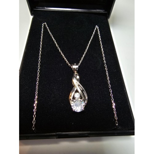 298 - A new and unused pretty 925 silver pendant inset with 2 sparkly CZ crystal stones on an 18