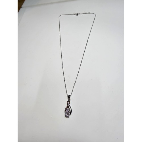 298 - A new and unused pretty 925 silver pendant inset with 2 sparkly CZ crystal stones on an 18