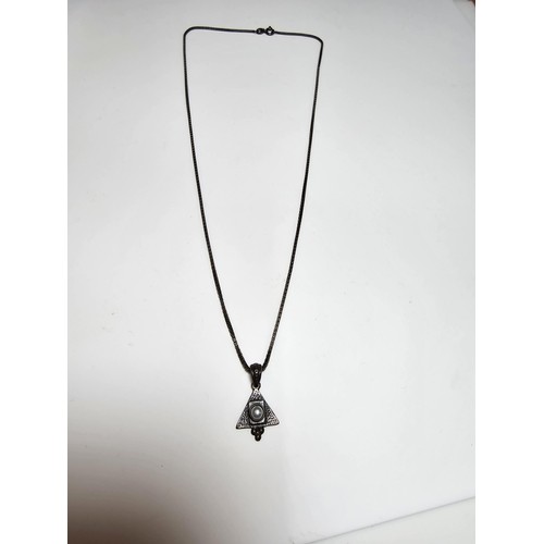 299 - An unusual 925 silver triangular pendant inset with a genuine pearl on a good long 20