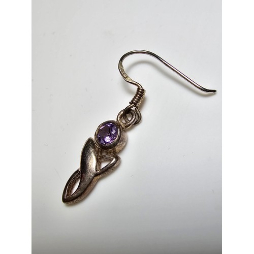 301 - A pair of 925 silver drop earrings inset with amethyst stones. In excellent clean condition and boxe... 