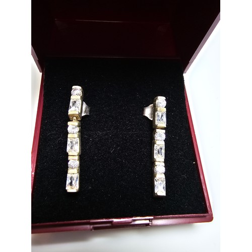 302 - A pair of 925 silver articulated drop earrings inset with sparkly crystal CZ stones, in good clean c... 