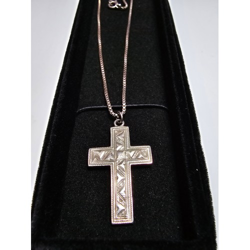 303 - A fully hallmarked 925 silver vintage engraved cross pendant set on a good long 20