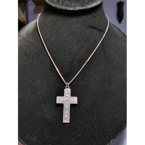 303 - A fully hallmarked 925 silver vintage engraved cross pendant set on a good long 20