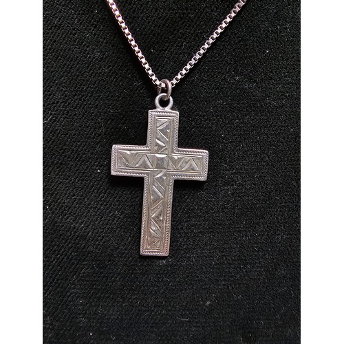 303 - A fully hallmarked 925 silver vintage engraved cross pendant set on a good long 20