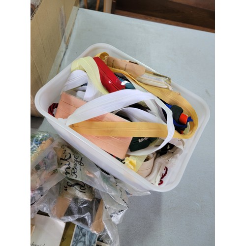 439 - Box containing a large quantity of sewing and knitting accessories inc sewing books, bobbins, tape m... 