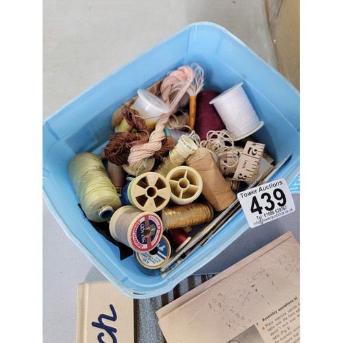 439 - Box containing a large quantity of sewing and knitting accessories inc sewing books, bobbins, tape m... 