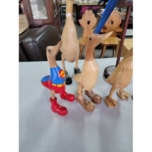 456 - Quantity of fair trade figures inc a graduated duck set, Superman duck, large Parrot on perch. One o... 