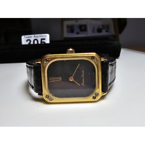 305 - A good quality vintage Maurice Lacroix ladies wrist watch with a leather strap featuring a 17 jewel ... 