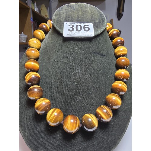 306 - An excellent quality Tigers eye large beaded necklace with a 925 silver clasp featuring 2cm diameter... 