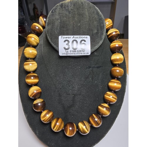 306 - An excellent quality Tigers eye large beaded necklace with a 925 silver clasp featuring 2cm diameter... 