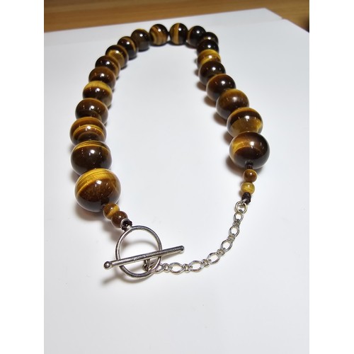 306 - An excellent quality Tigers eye large beaded necklace with a 925 silver clasp featuring 2cm diameter... 