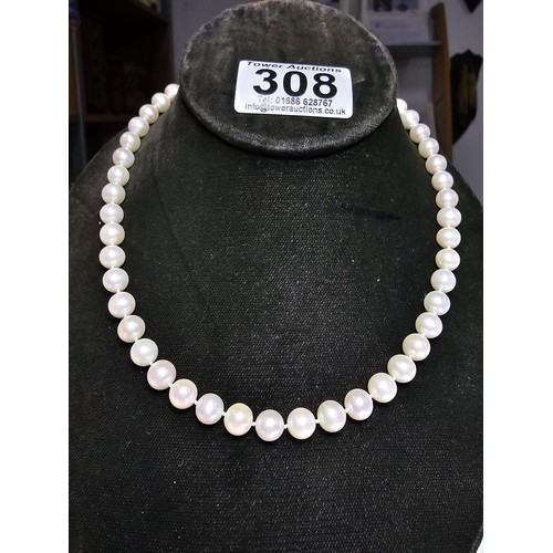 308 - A collection of pearl necklaces to include a good quality genuine pearl beaded necklace with a silve... 