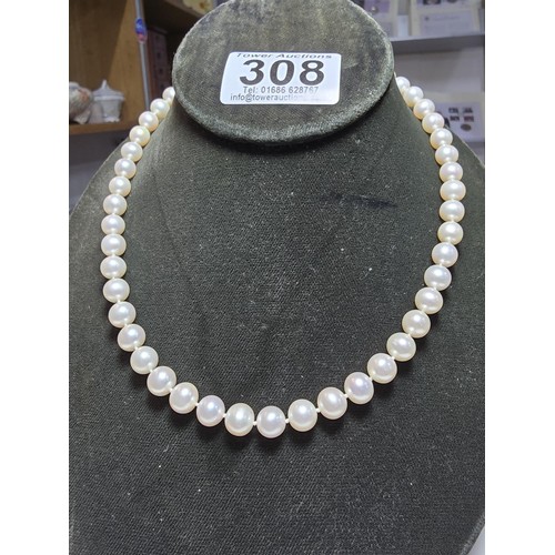 308 - A collection of pearl necklaces to include a good quality genuine pearl beaded necklace with a silve... 