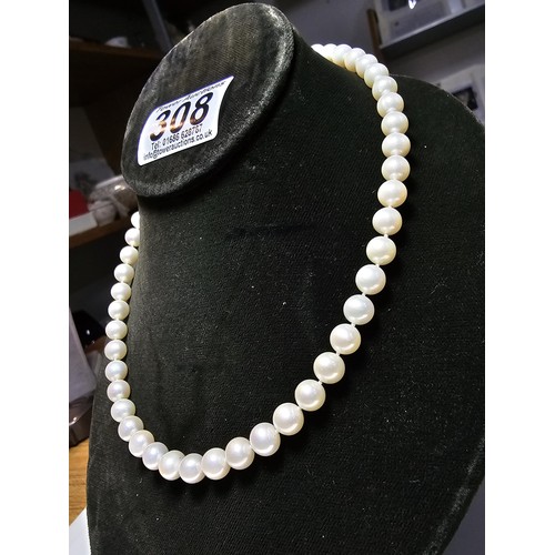 308 - A collection of pearl necklaces to include a good quality genuine pearl beaded necklace with a silve... 